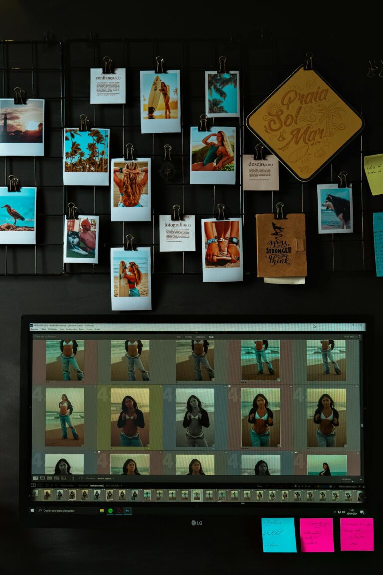 A workspace featuring a photo collage and a digital display showcasing images in a vibrant and creative setup.